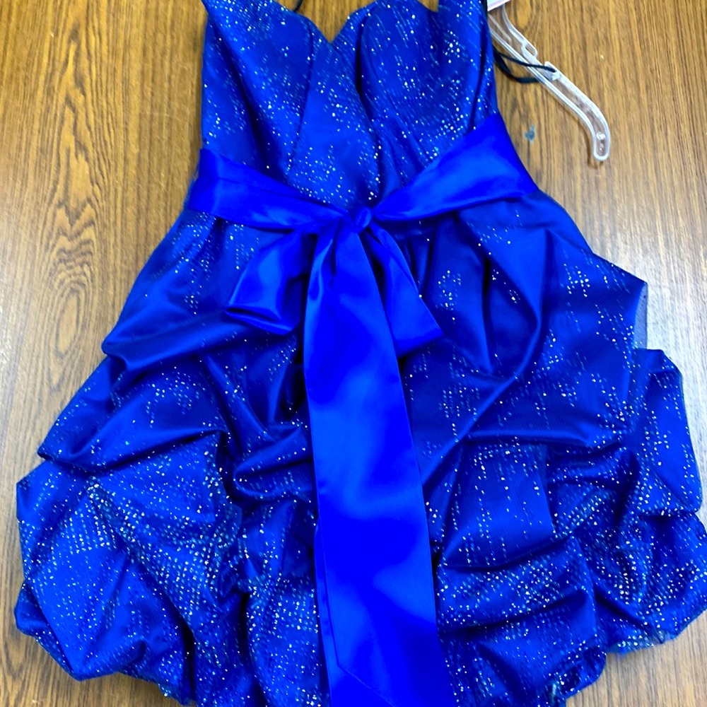 This short strapless blue & silver sequined dress with satin bow is gorgeous.